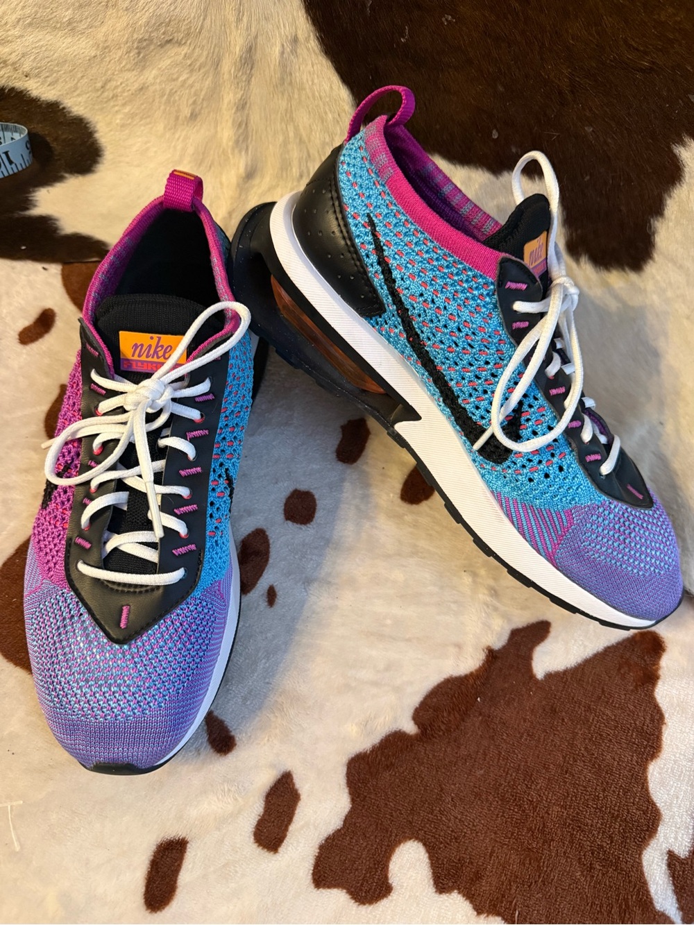 Nike Women’s Flyknit Trainers in Turquoise, Purple & Pink